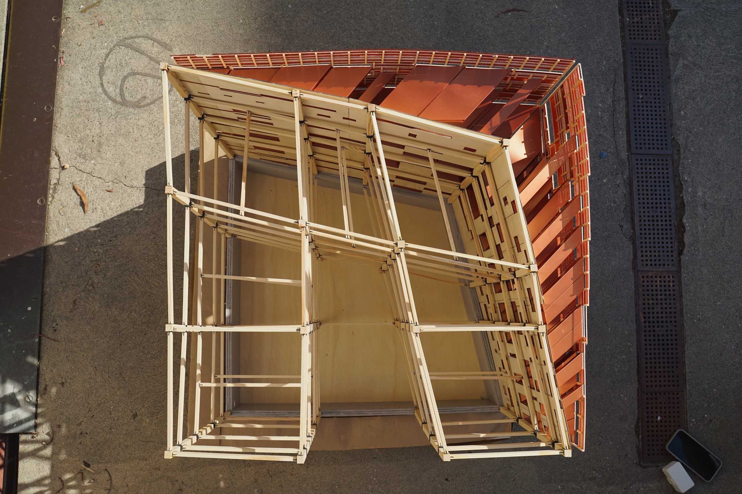 Looking down into the timber stick frame wrapped in copper panels.